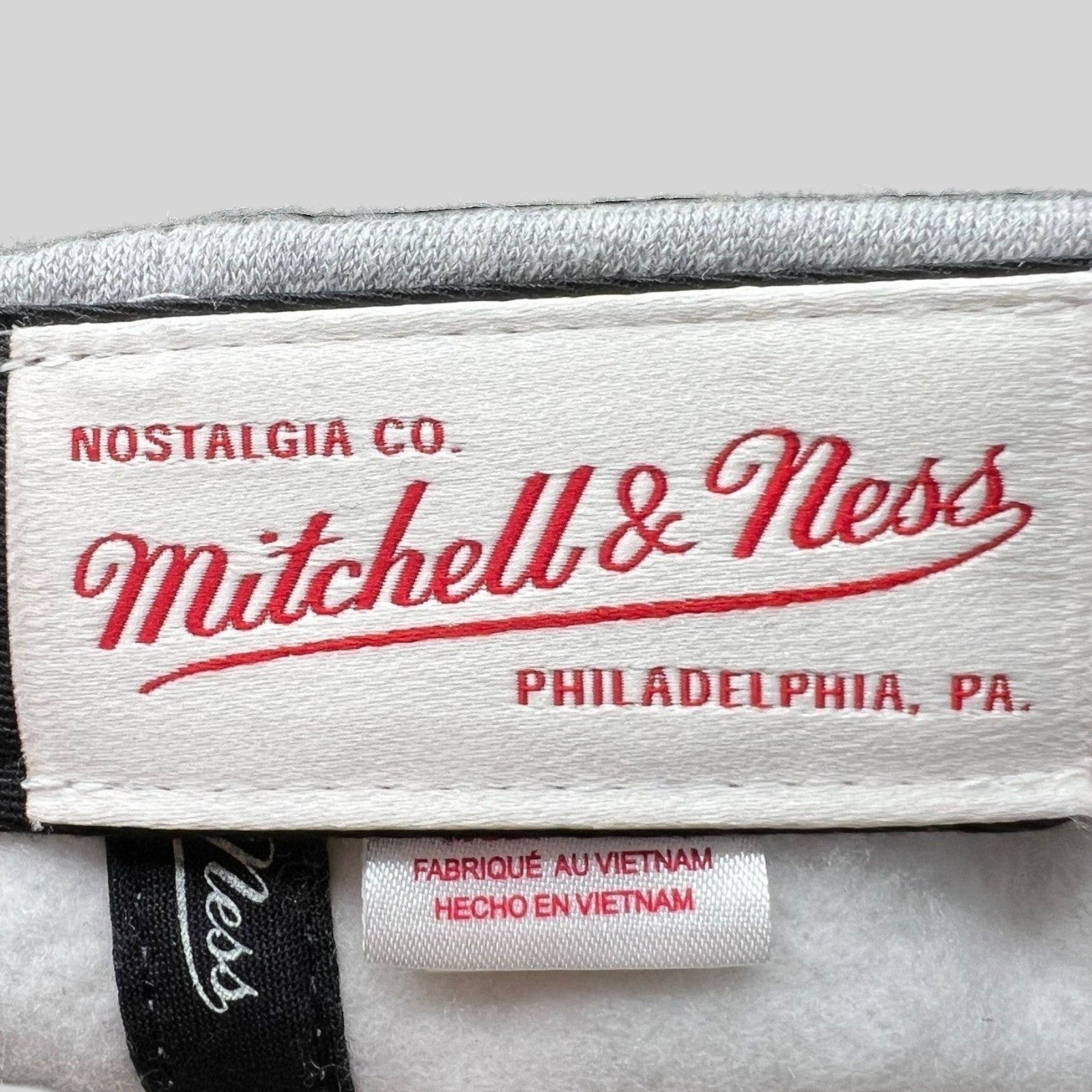 Raree Finds Mitchell & Ness Nostalgia Co. interior brand label and Vietnam origin tag inside a Cavaliers snapback hat.