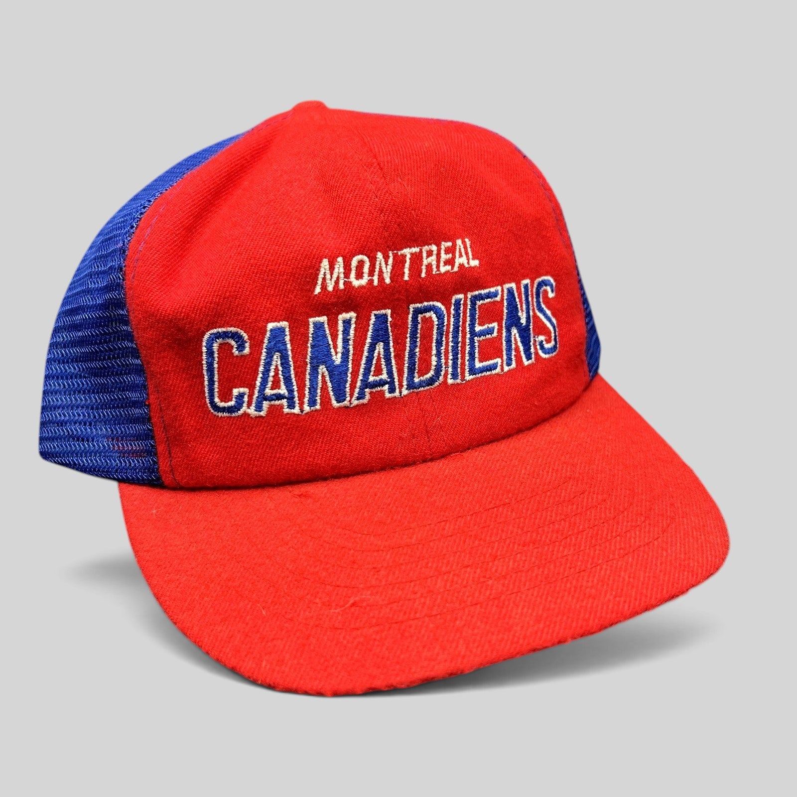 Raree Finds vintage Montreal Canadiens NHL mesh trucker snapback hat in red and blue with embroidered script logo.