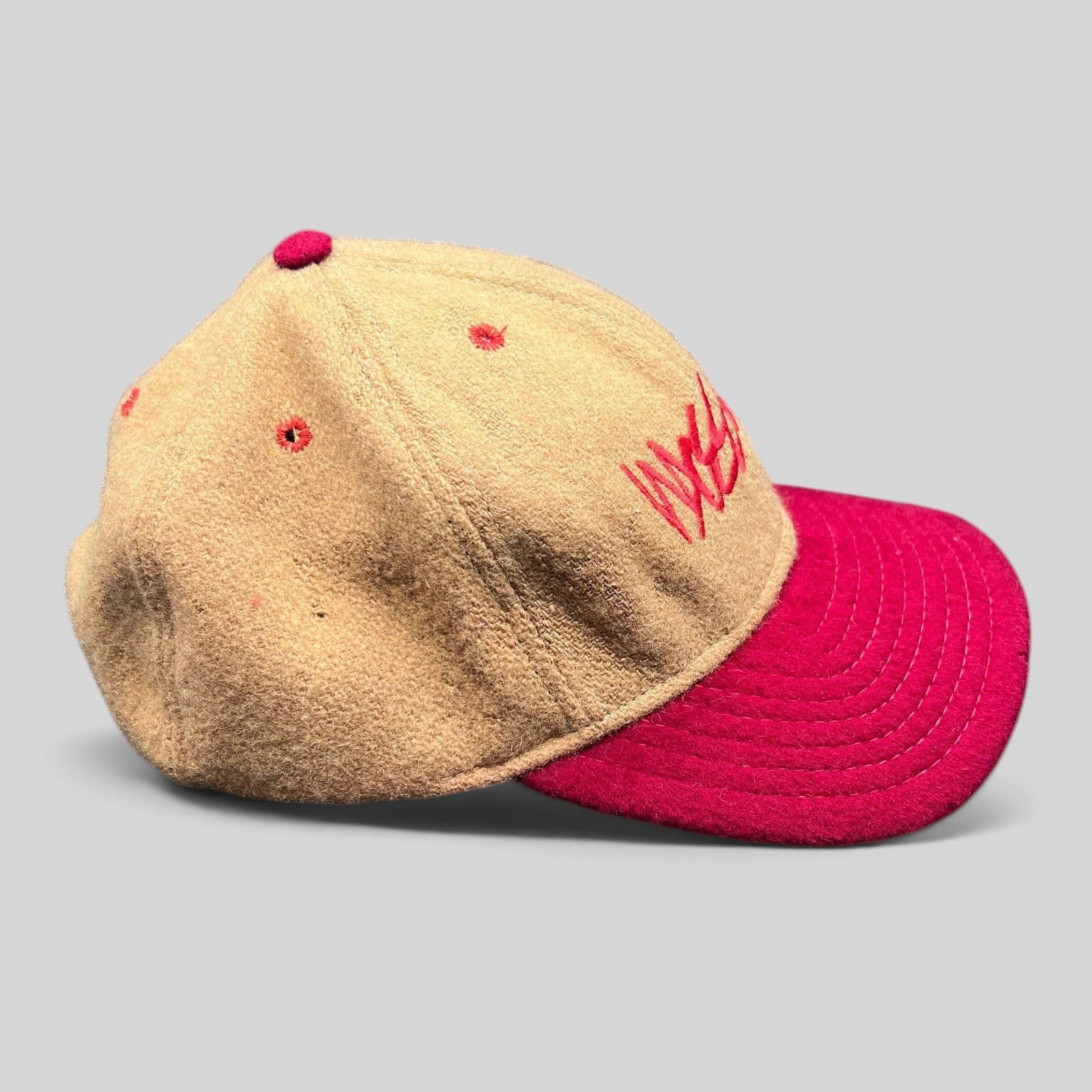 Raree Finds vintage Mossimo wool snapback hat in camel and red with embroidered script logo and structured crown.