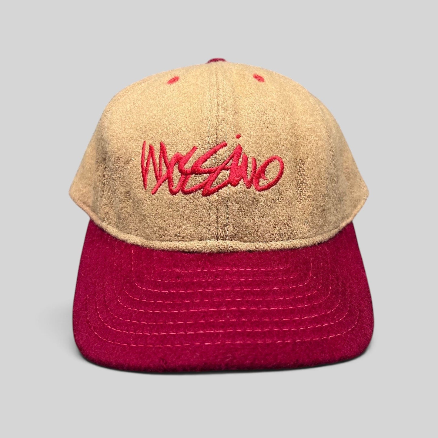 Raree Finds vintage Mossimo wool snapback hat in camel and red with embroidered script logo, front view.
