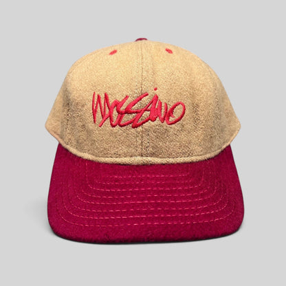 Raree Finds vintage Mossimo wool snapback hat in camel and red with embroidered script logo, front view.