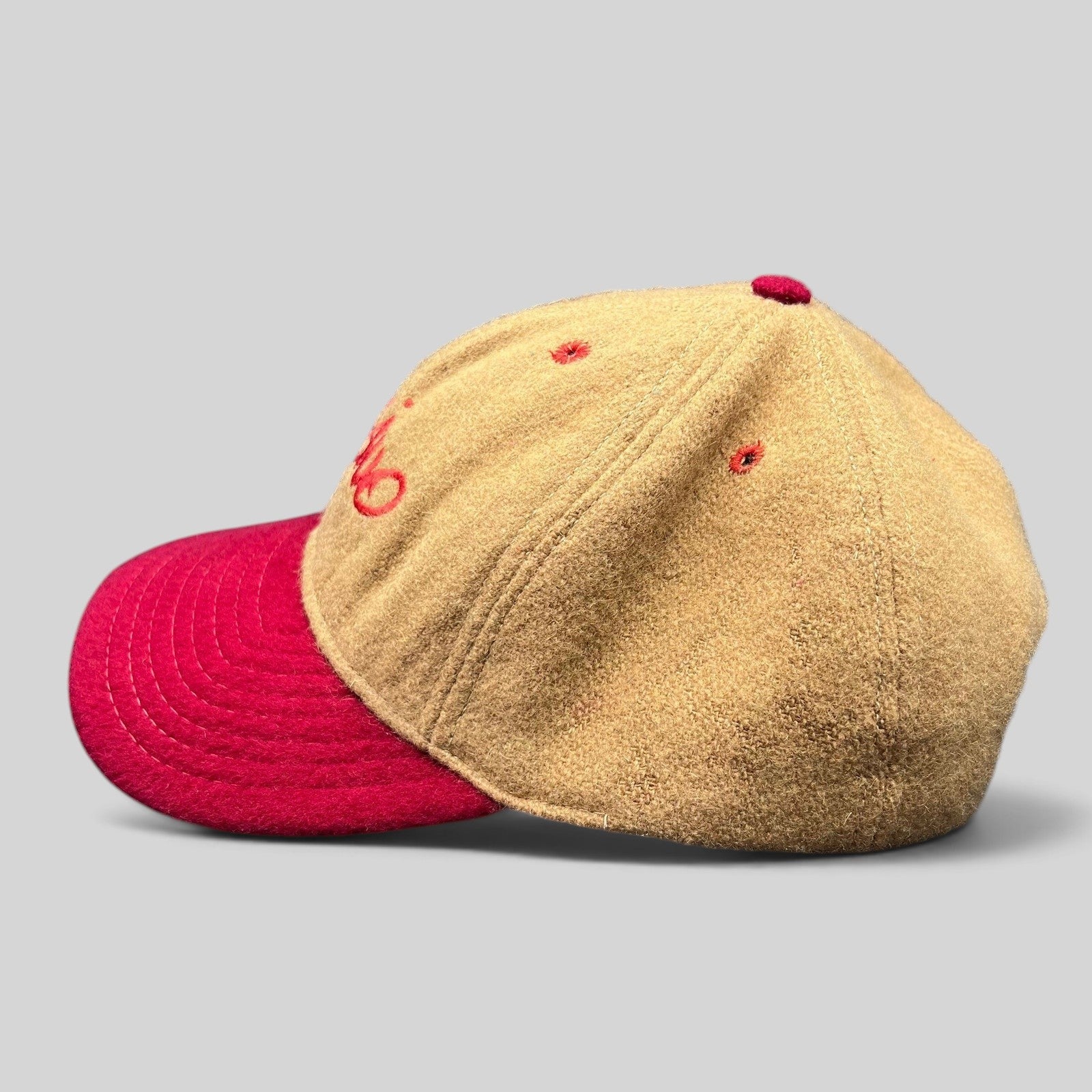 Raree Finds vintage Mossimo wool snapback hat in camel and red with embroidered script logo and structured crown.