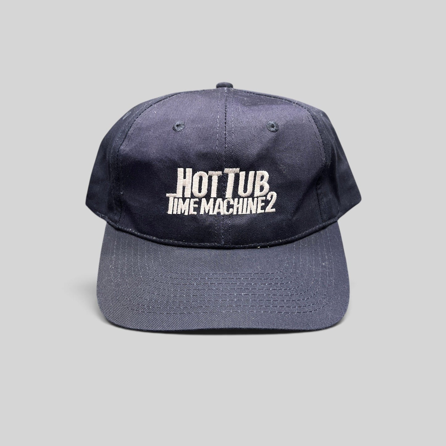 Raree Finds navy cotton-poly promotional cap with white Hot Tub Time Machine 2 embroidery and adjustable strap
