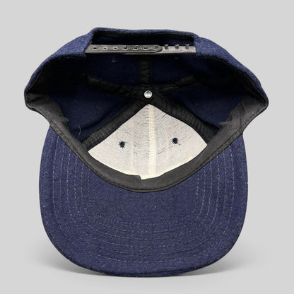 Raree Finds vintage 90s No Fear Gear navy wool snapback hat interior view showing adjustable black plastic strap