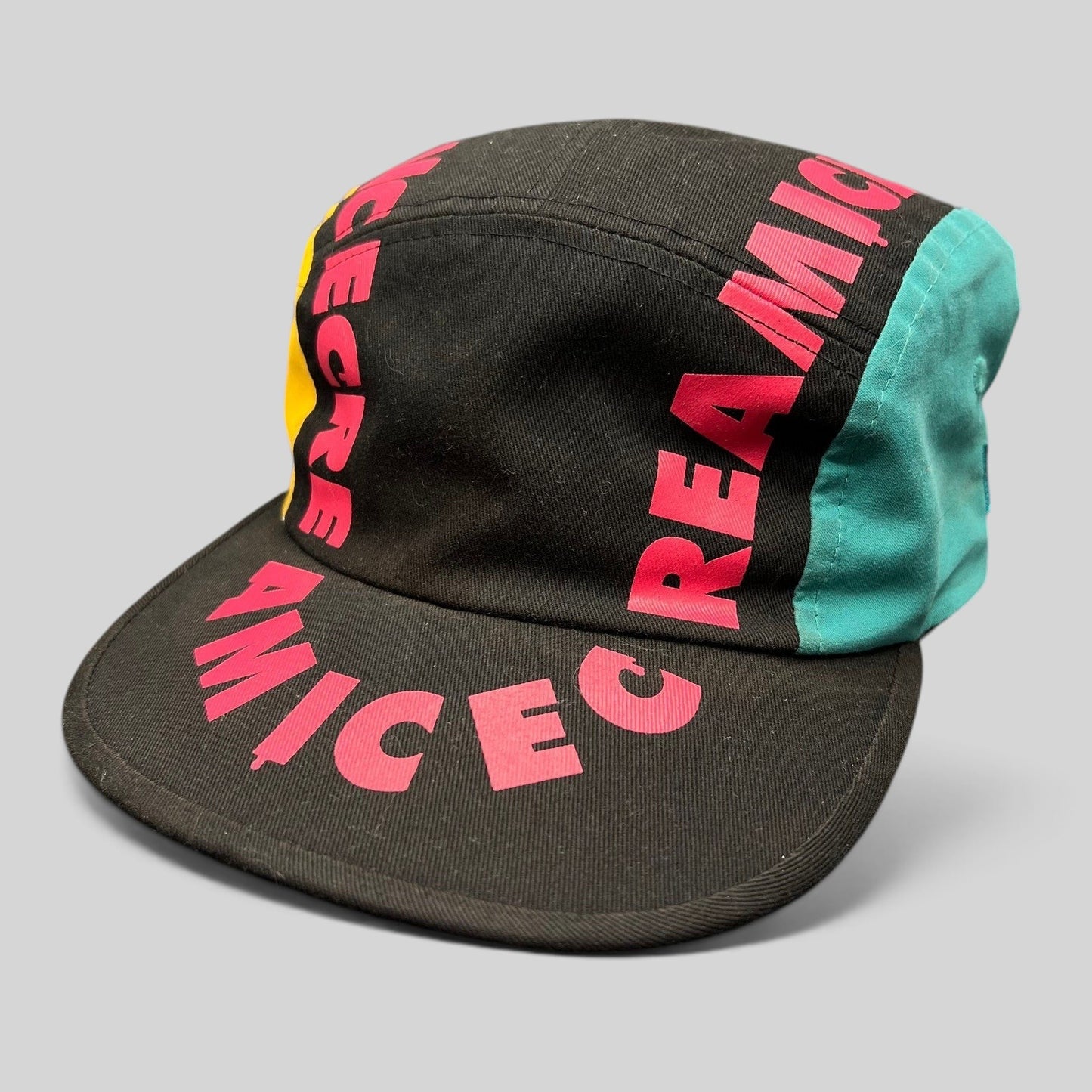Raree Finds New Era Ice Cream America strapback hat in black cotton with pink graphic text and teal and yellow panels