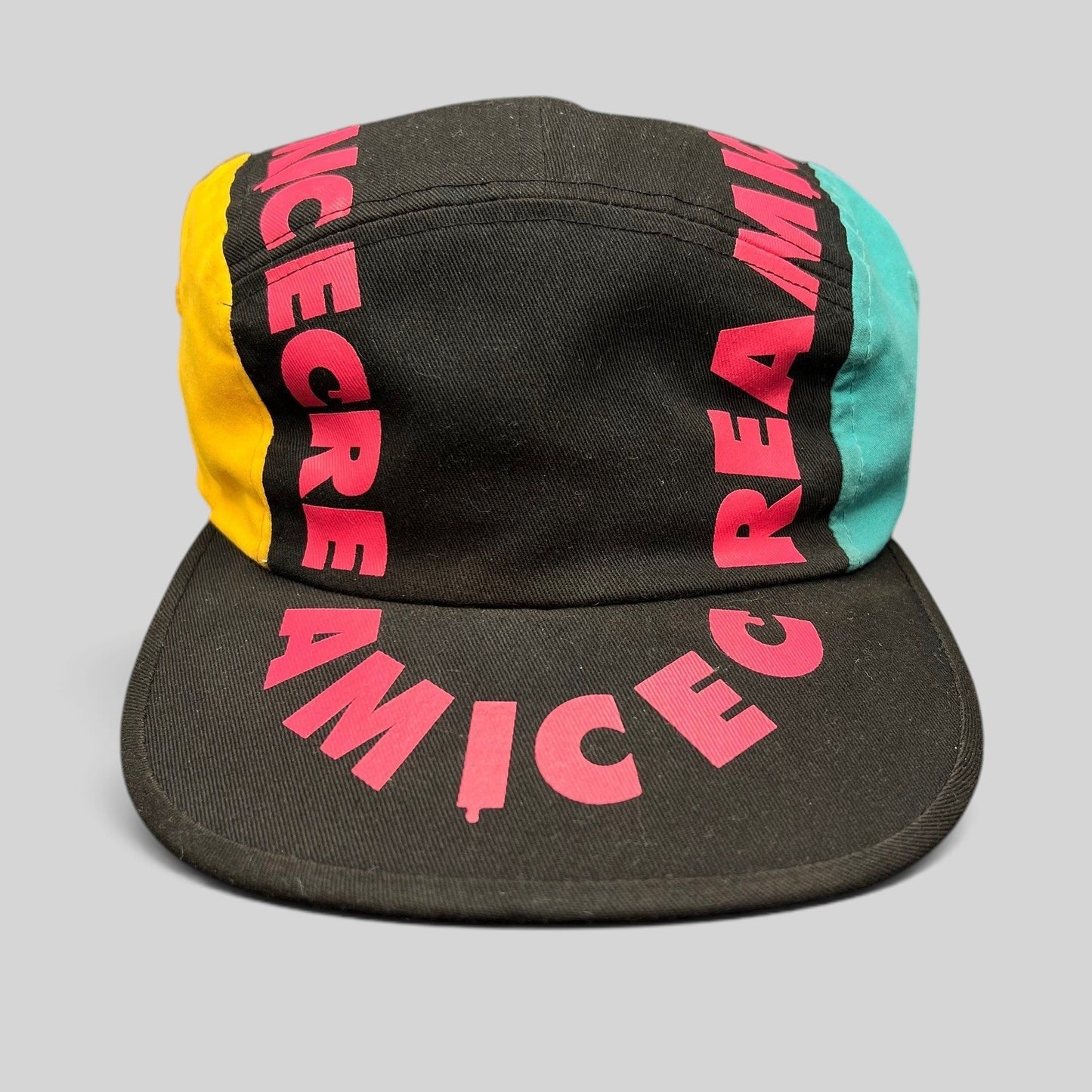 Raree Finds New Era Ice Cream America strapback hat in black cotton with vibrant pink text and teal yellow panels