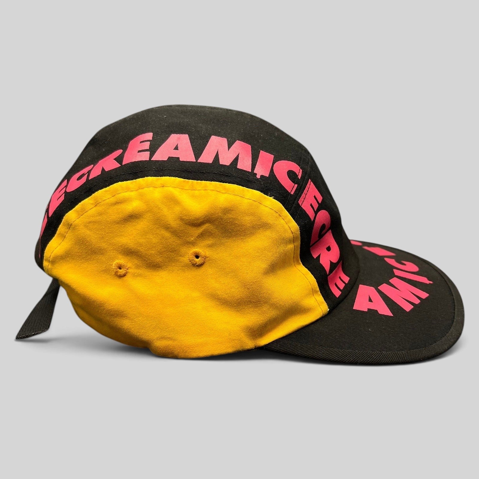 Raree Finds New Era Ice Cream America strapback hat in black with pink graphic text and yellow side panel