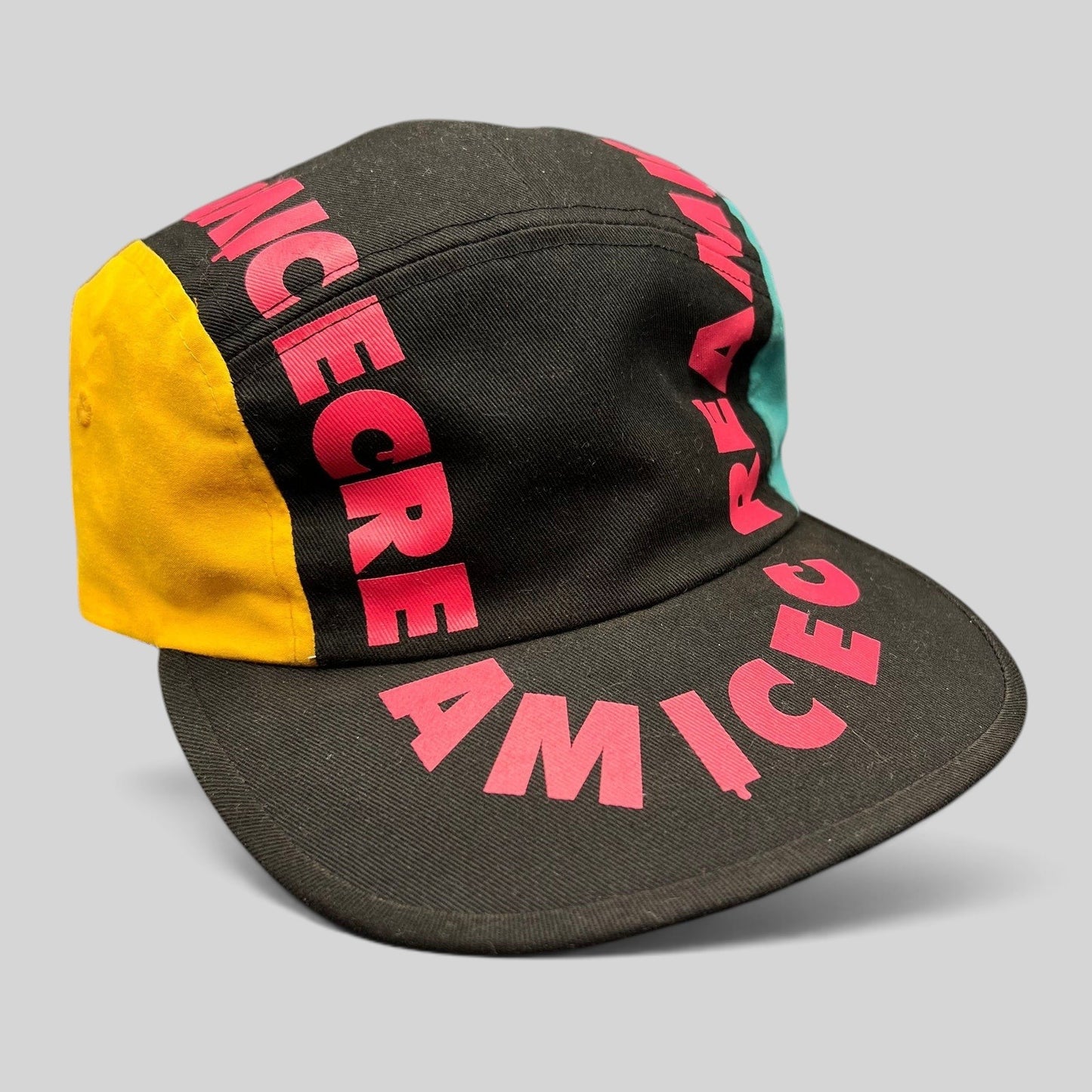 Raree Finds New Era Ice Cream America cotton strapback hat with pink graphic text, yellow and teal side panels.