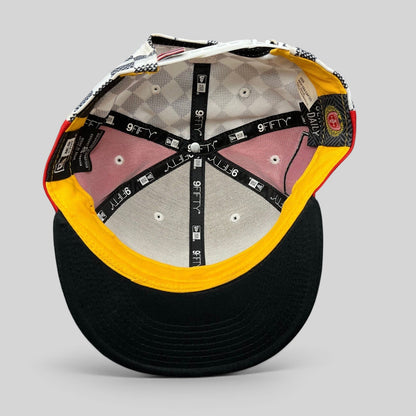 Interior view of a Raree Finds New Era King of Tantalus snapback hat showing branded taping and patterned lining