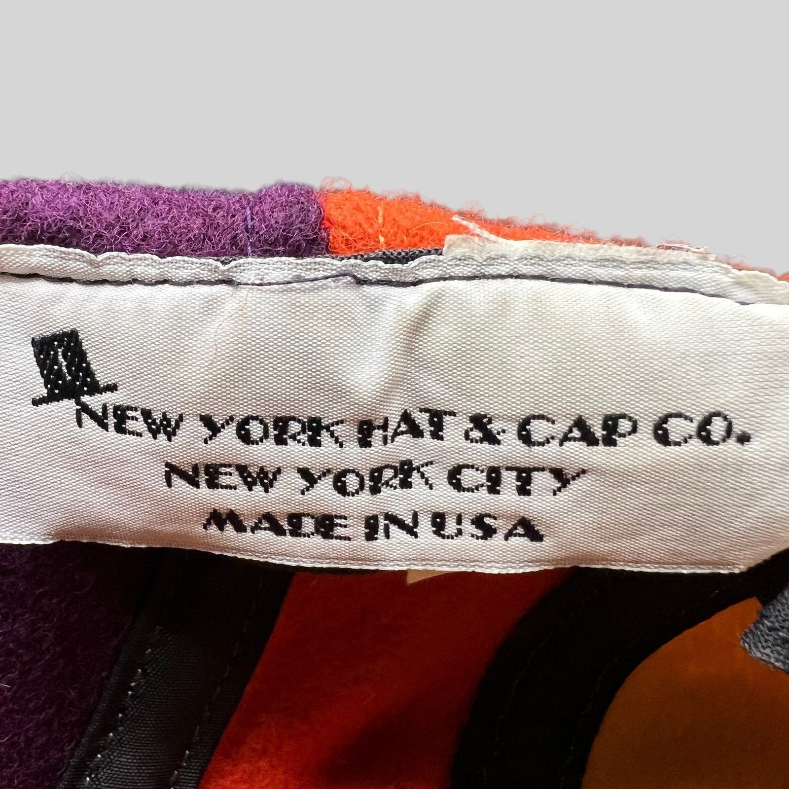 Raree Finds vintage New York Hat Co wool cap interior label showing Made in USA branding against color block panels
