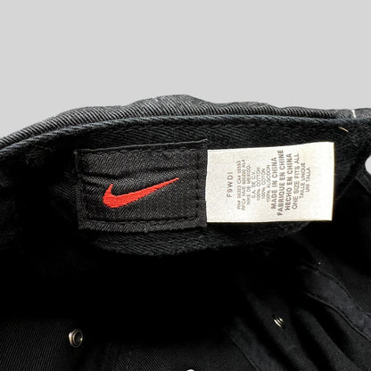 Raree Finds vintage Nike soccer hat interior showing the black cotton fabric, care tag, and red Nike swoosh label.