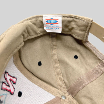 Raree Finds vintage 1996 Tostitos Fiesta Bowl snapback hat interior showing the Nissin Cap brand label and tan lining.