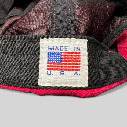 Raree Finds NOAH strapback hat interior tag showing Made in USA embroidery on a red cotton cap