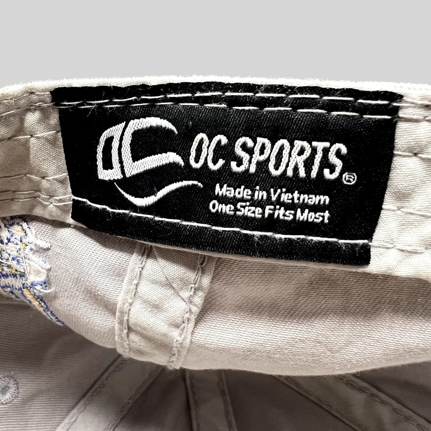 Raree Finds OC Sports branded interior label on a cream cotton baseball cap with Made in Vietnam text
