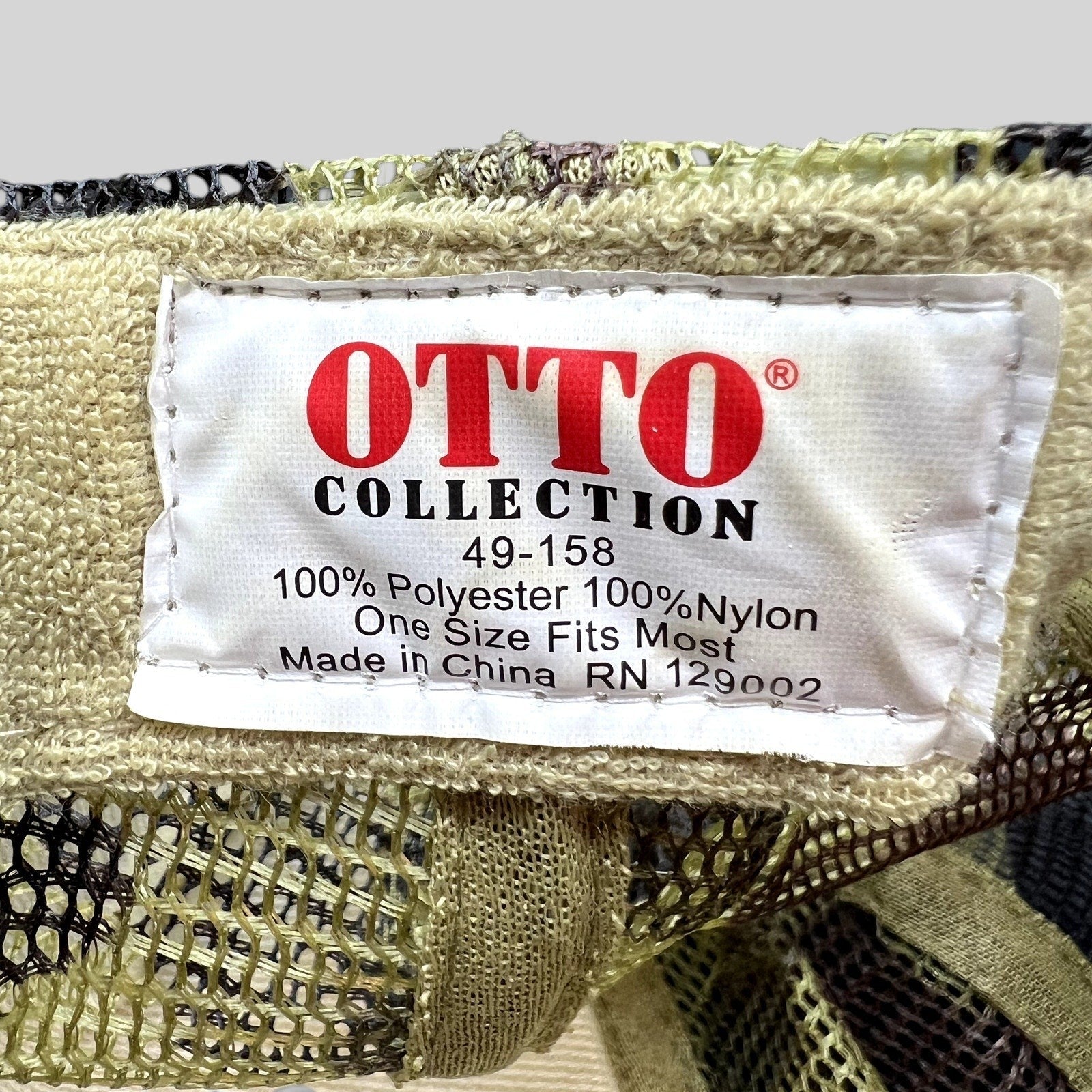 Raree Finds OTTO Collection trucker hat interior tag showing material composition and manufacturing details