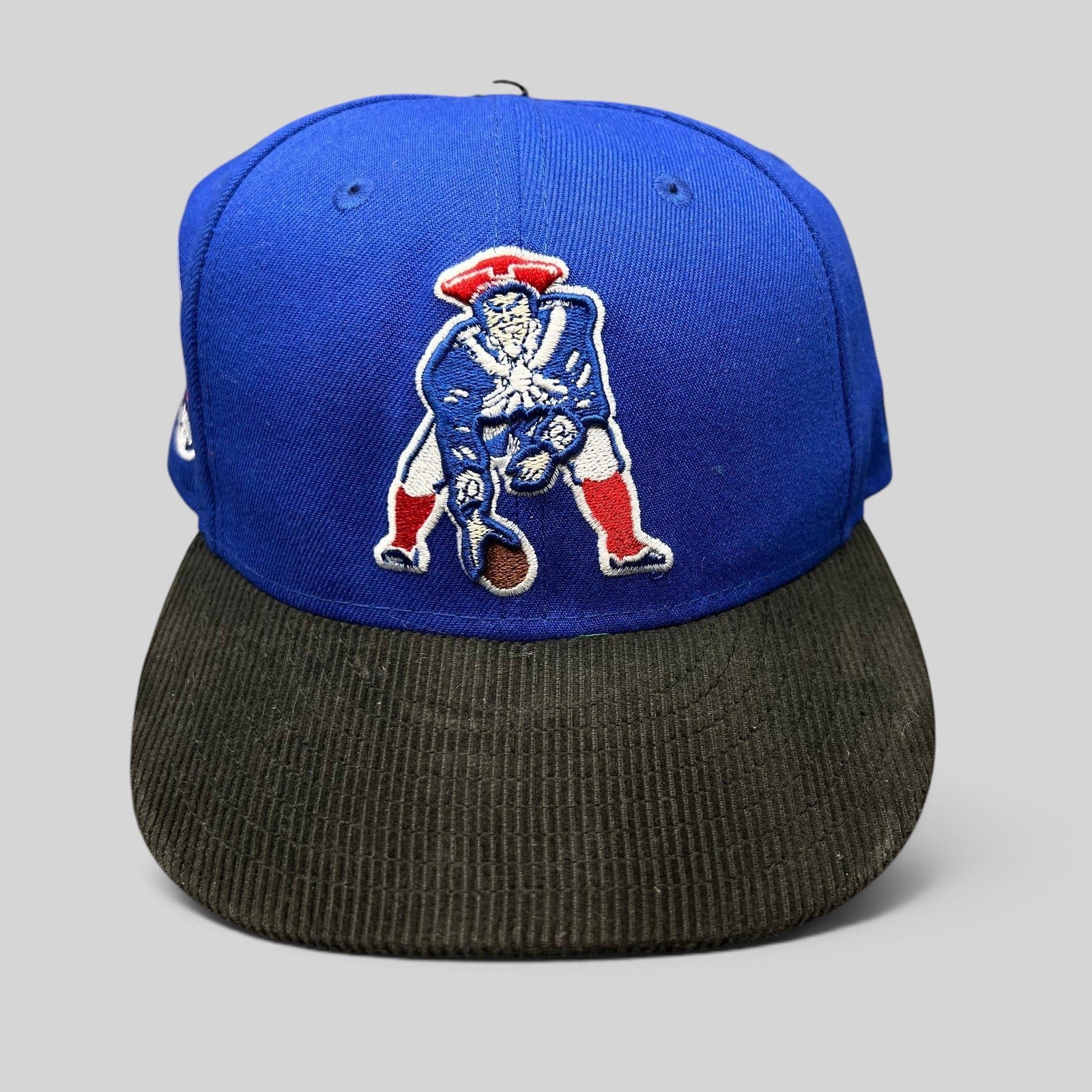 Raree Finds New Era 59FIFTY New England Patriots fitted hat with a royal blue crown and black corduroy brim.