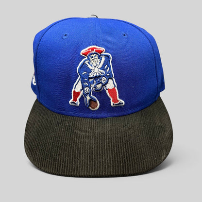Raree Finds New Era 59FIFTY New England Patriots fitted hat with a royal blue crown and black corduroy brim.