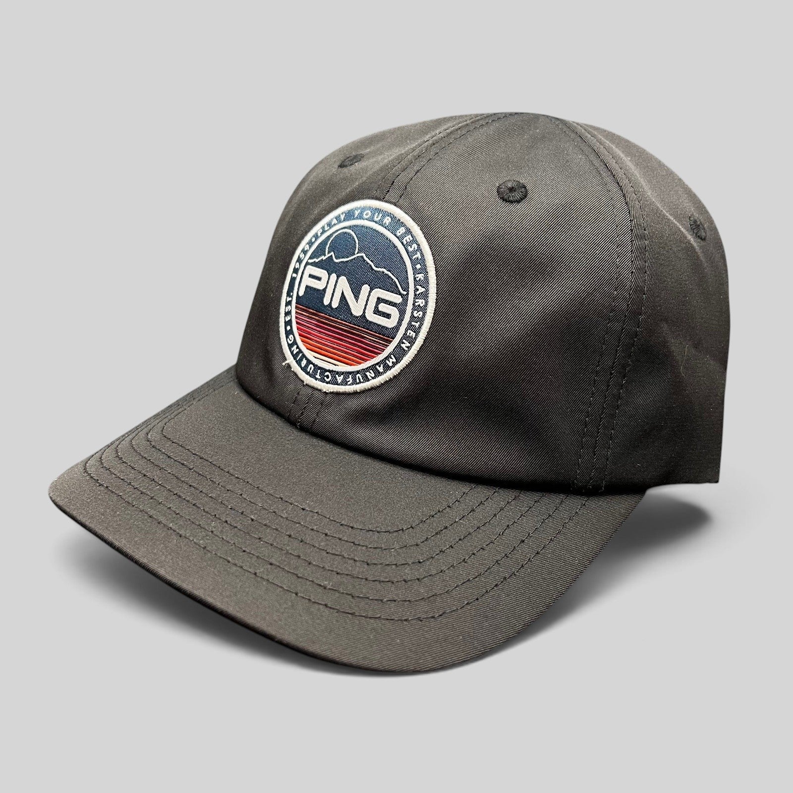 Raree Finds black PING golf strapback hat featuring a circular embroidered mountain patch logo and SensorCool fabric.