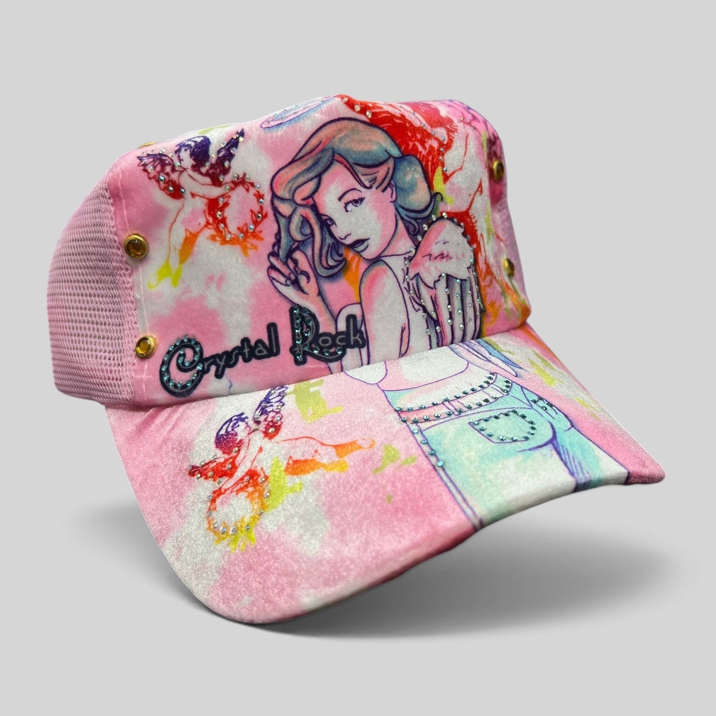Raree Finds Crystal Rock by Christian Audigier pink trucker hat with angel graphic, rhinestones, and metallic studs.