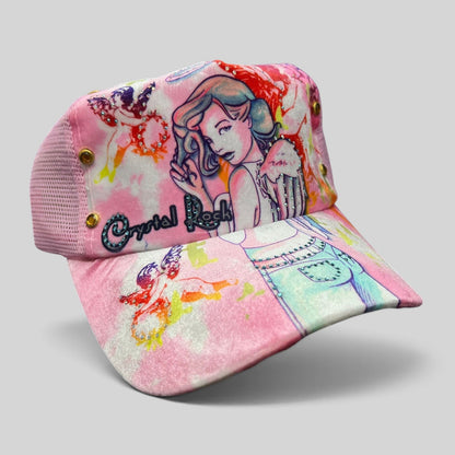 Raree Finds Crystal Rock by Christian Audigier pink trucker hat with angel graphic, rhinestones, and metallic studs.