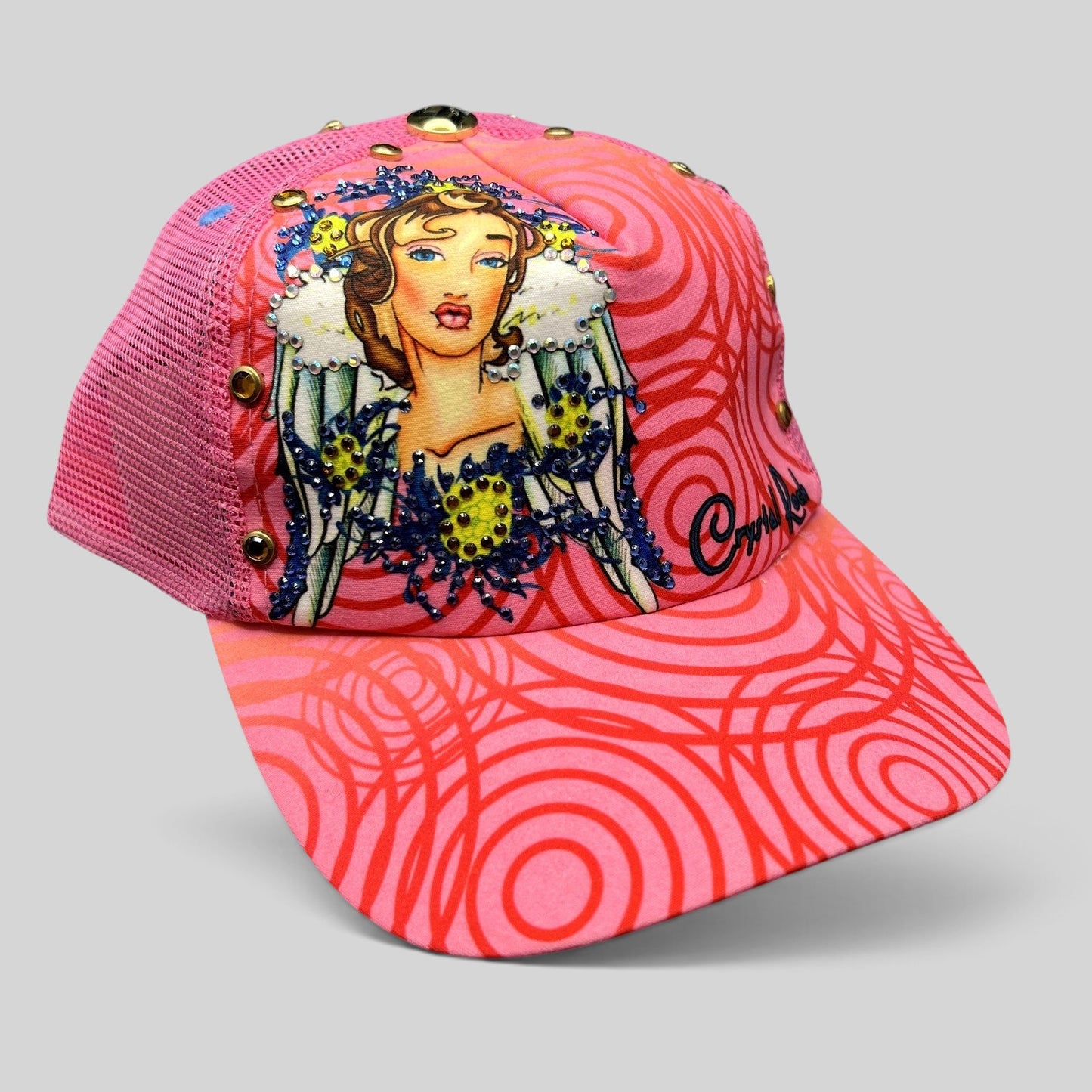 Raree Finds Crystal Rock by Christian Audigier pink trucker hat with rhinestone angel graphic and swirl pattern