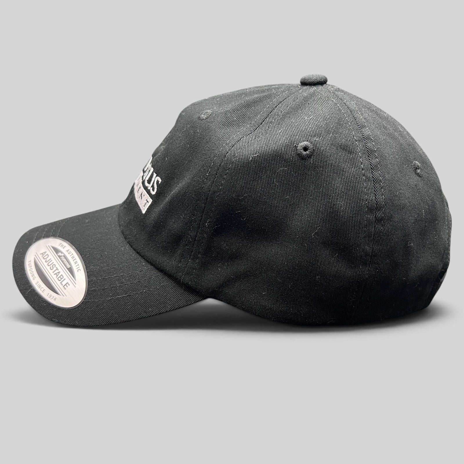 Raree Finds black Yupoong strapback hat with white Prometheus Entertainment logo embroidery and curved brim