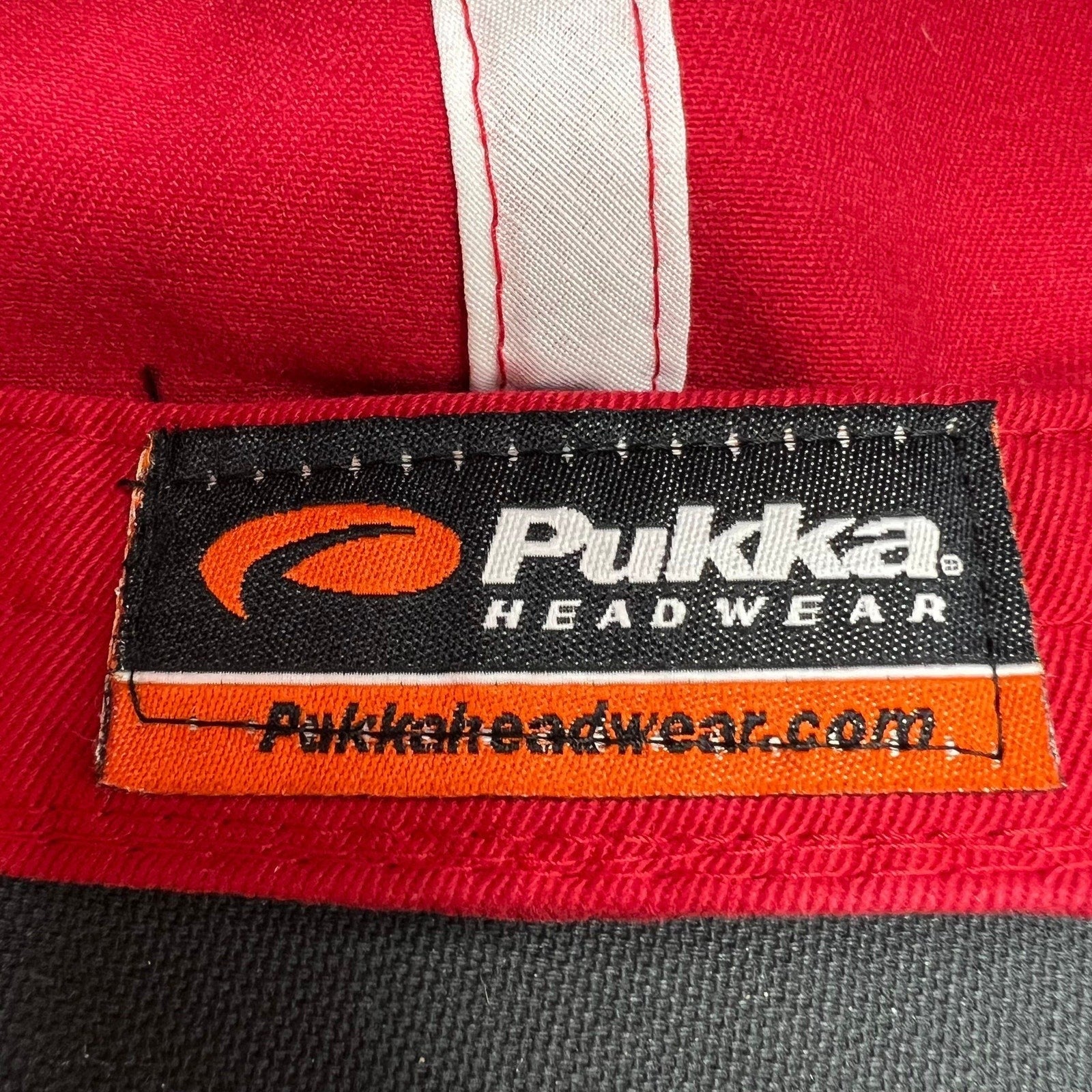 Raree Finds Pukka Headwear brand label stitched inside a red and black vintage golf cap