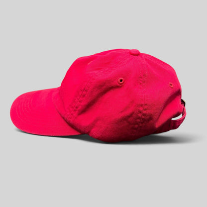 Raree Finds red cotton unstructured strapback hat with embroidered logo, side profile view.