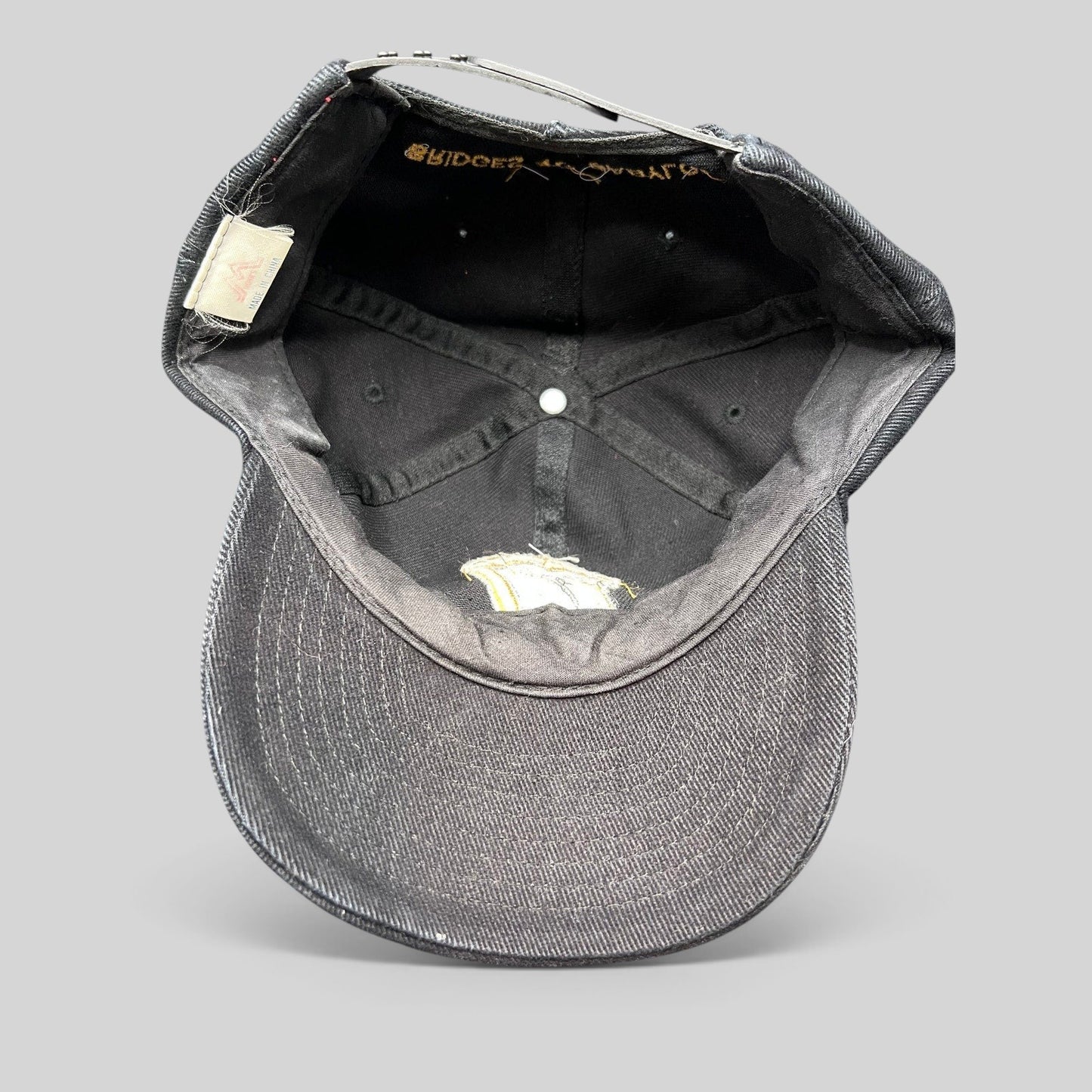 Raree Finds vintage 1997 Rolling Stones Bridges to Babylon black cotton snapback hat interior view with brand tag