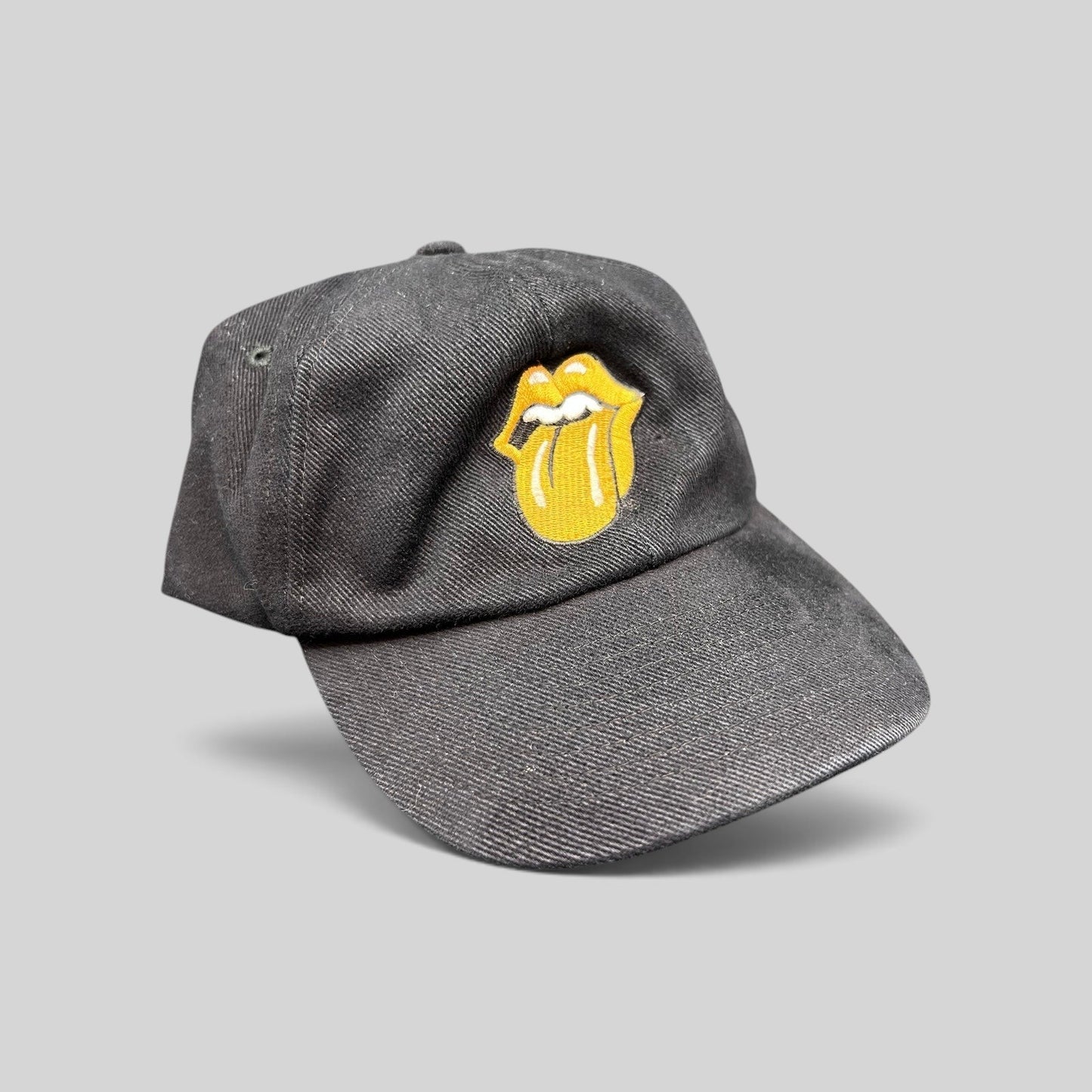 Raree Finds vintage 1997 Rolling Stones Bridges to Babylon black cotton snapback hat with gold tongue logo embroidery