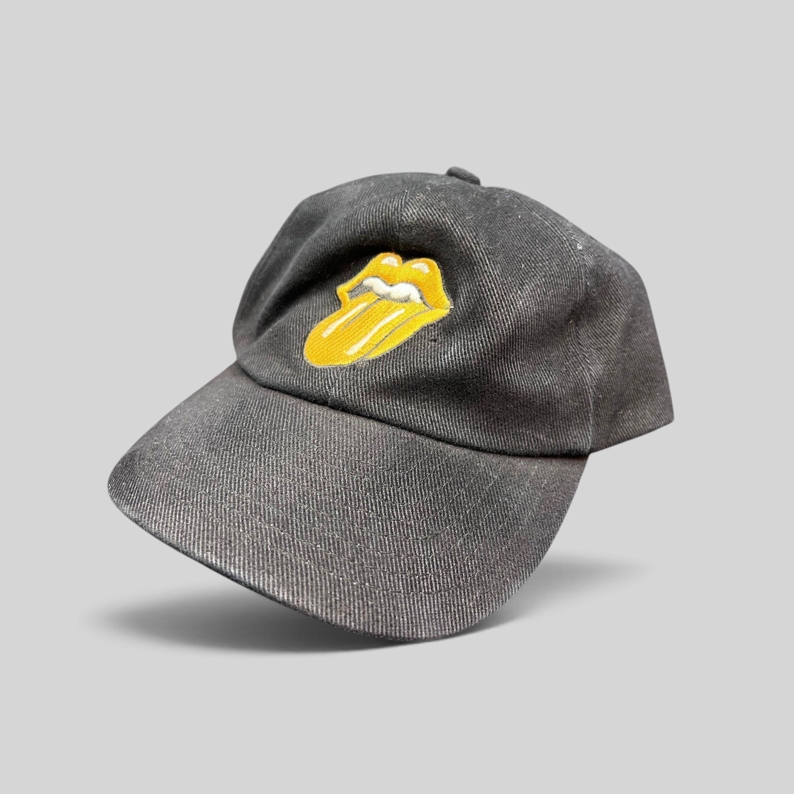 Raree Finds vintage 1997 Rolling Stones Bridges to Babylon black cotton snapback hat with gold tongue logo embroidery