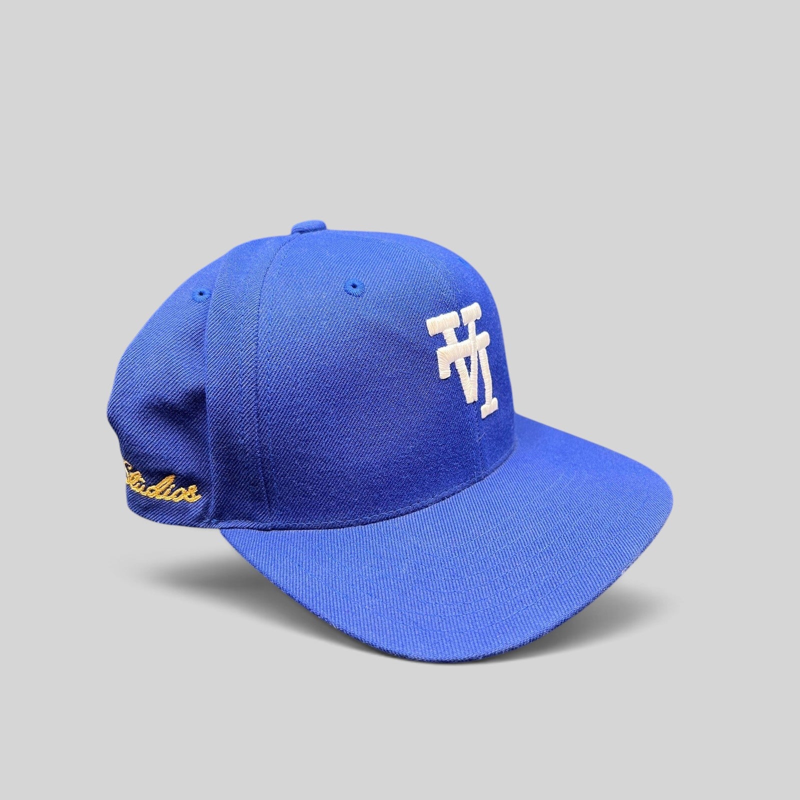Raree Finds royal blue Uniform Studios snapback hat with white embroidered logo and side detailing