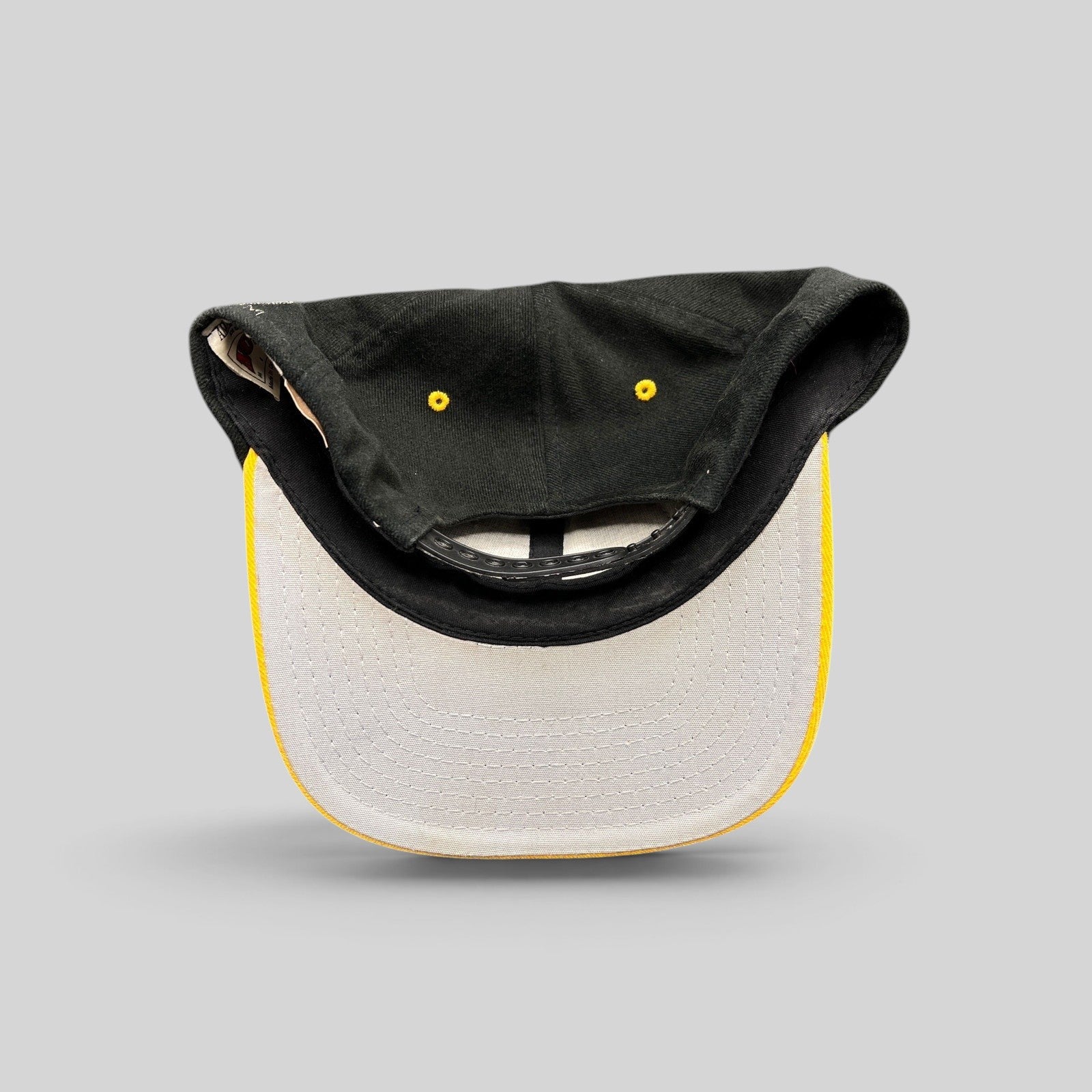 Raree Finds vintage Pittsburgh Steelers Nutmeg Mills snapback hat showing the gray underbrim and plastic closure