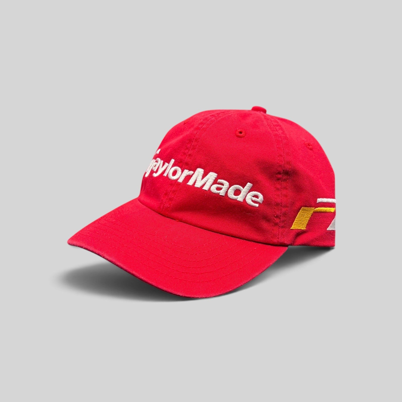 Raree Finds TaylorMade red cotton strapback golf hat with white logo embroidery and a curved brim.