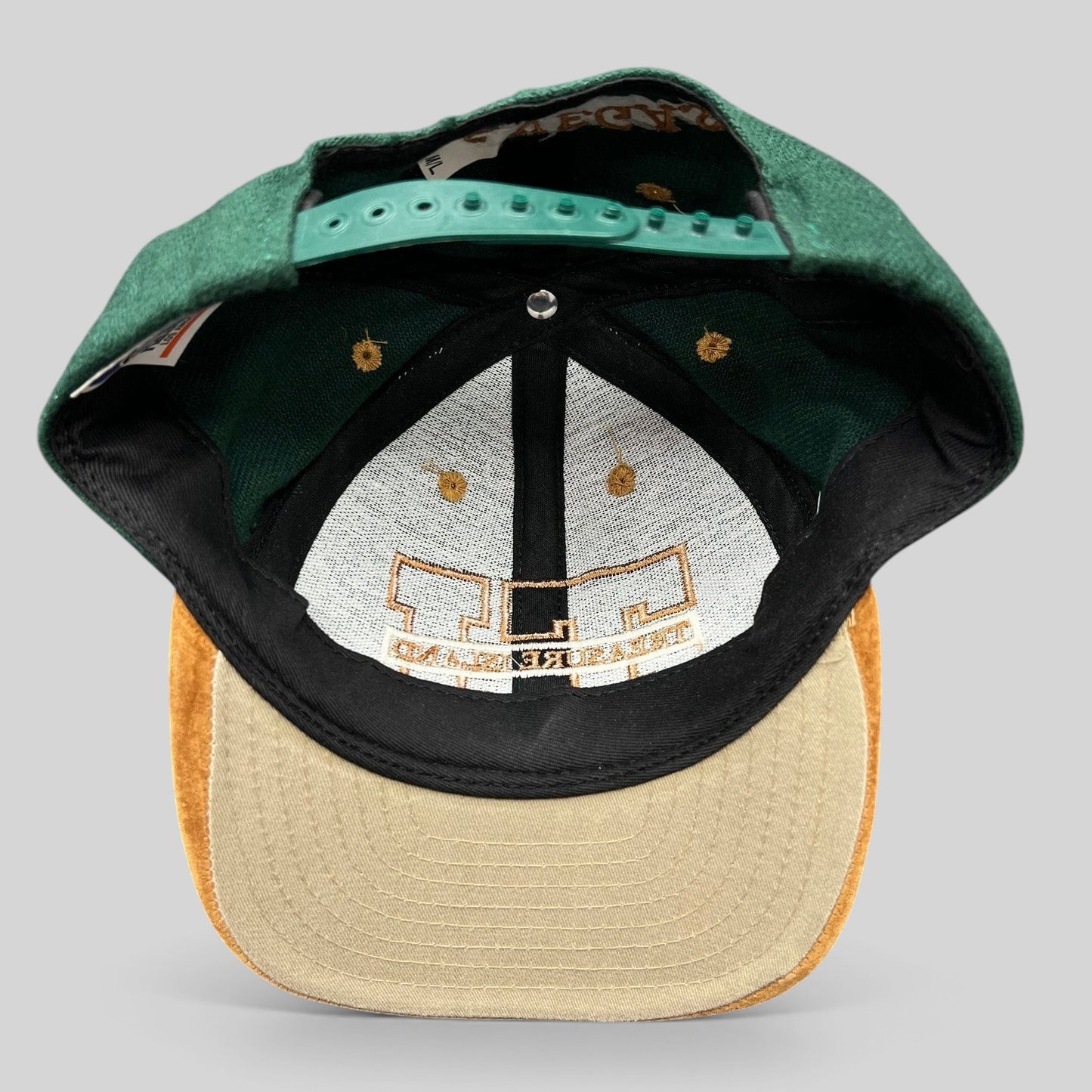 Raree Finds vintage Treasure Island Las Vegas snapback hat with green wool crown and tan suede brim interior view