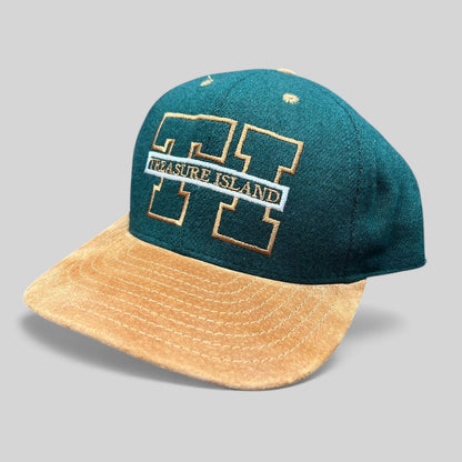 Raree Finds vintage Treasure Island Las Vegas snapback hat with a green wool crown and tan suede brim.