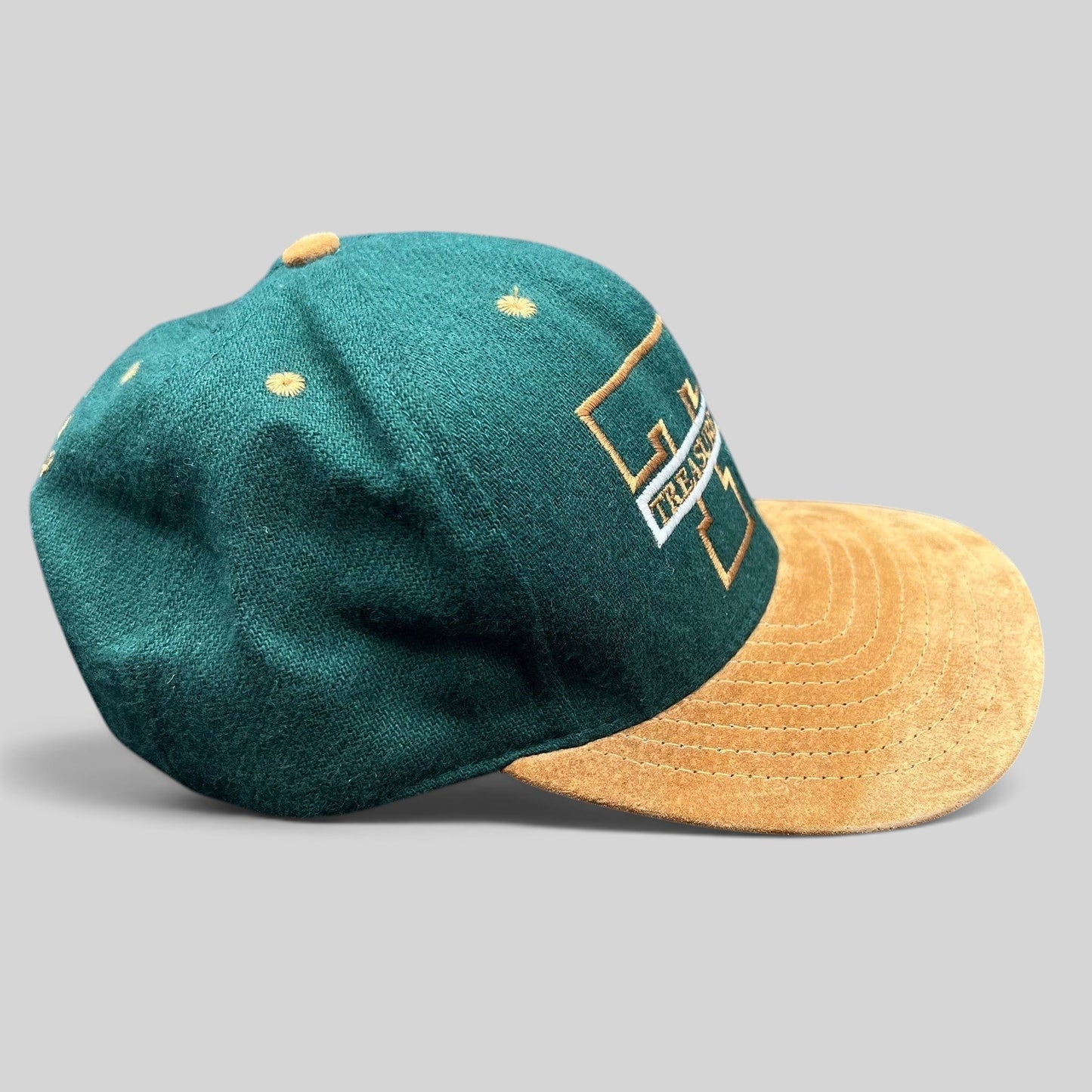 Raree Finds vintage Treasure Island Las Vegas snapback hat with a green wool crown and tan suede brim.