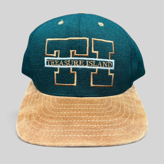 Raree Finds vintage Treasure Island Las Vegas snapback hat with a green wool crown and tan suede brim.