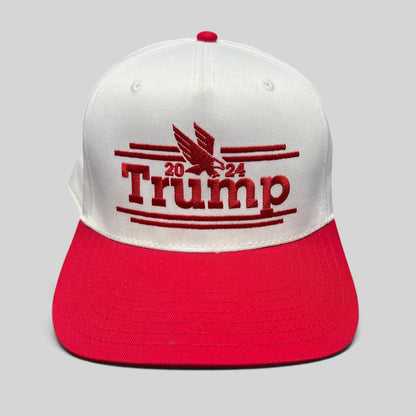 Raree Finds Trump 2024 snapback hat with white crown, red bill, and red embroidered eagle logo on front panel.