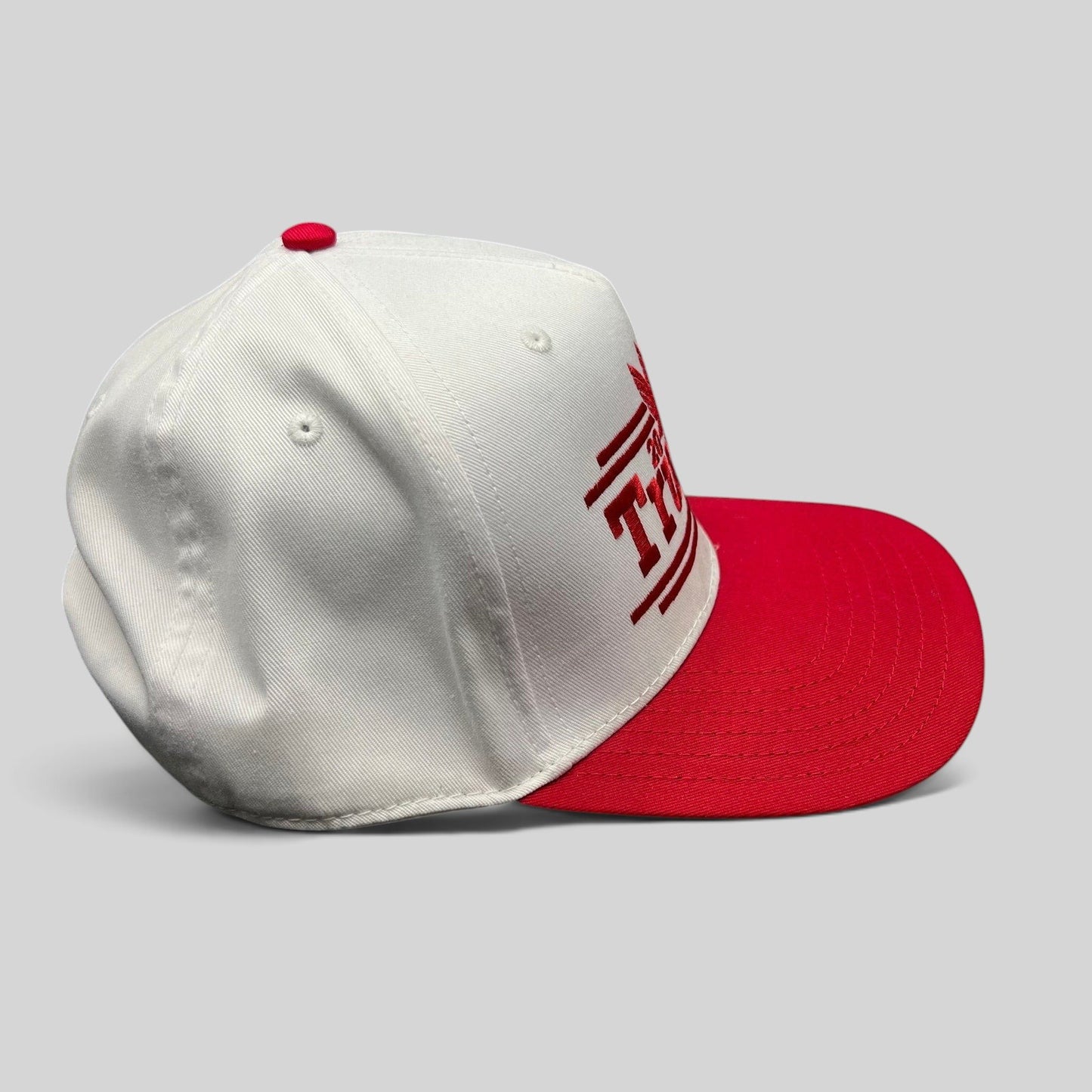 Raree Finds Trump 2024 campaign snapback hat with a white crown, red bill, and bold red embroidered front text.