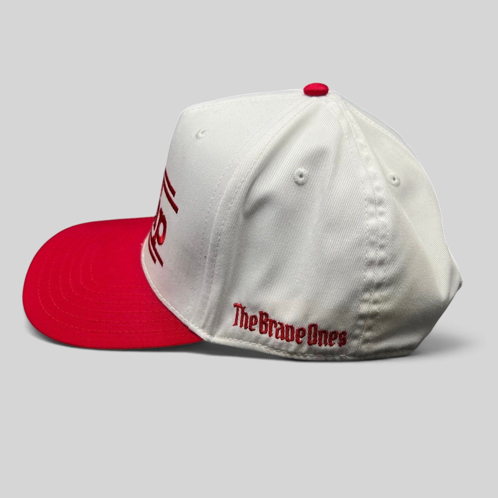 Raree Finds white and red Trump 2024 snapback hat with The Brave Ones embroidery on the side panel