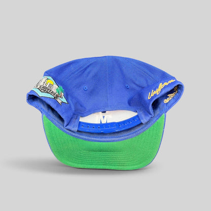 Raree Finds Uniform Studios Los Angeles royal blue snapback hat with green undervisor and city patch detail