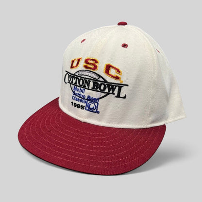 Raree Finds vintage 1995 USC Cotton Bowl snapback hat with white crown, cardinal red brim, and embroidered logo.