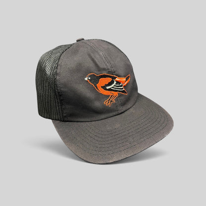 Raree Finds vintage 1980s Baltimore Orioles black mesh snapback hat with embroidered orange bird logo and green brim.