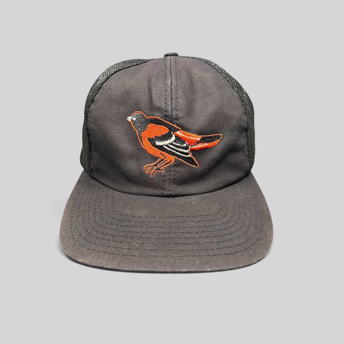 Raree Finds vintage 1980s Baltimore Orioles black mesh back snapback hat with embroidered team logo and green underbrim