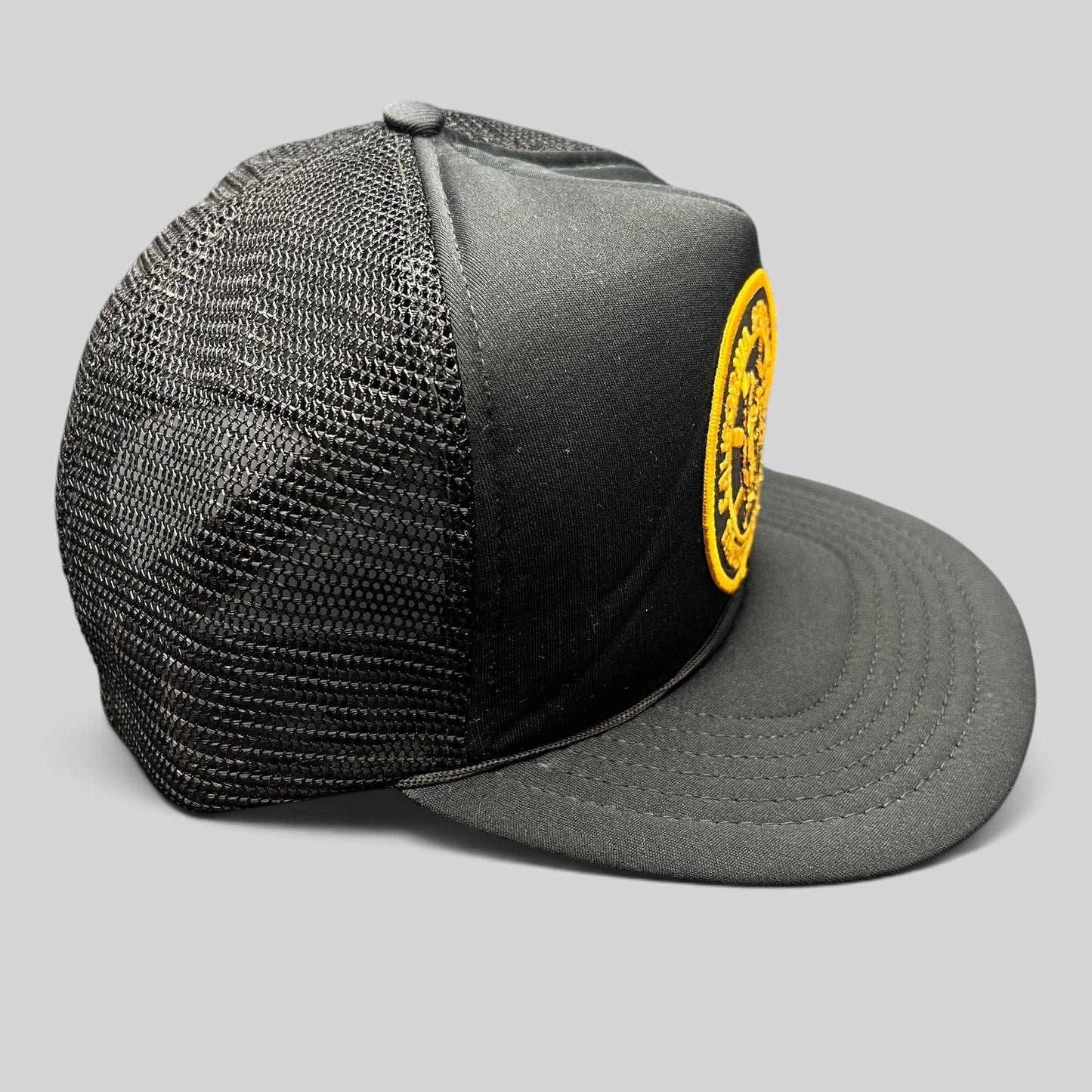 Raree Finds vintage black foam trucker hat with gold embroidered California Specialized Training Institute patch