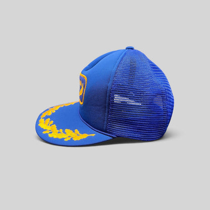 Raree Finds vintage 1980s royal blue foam trucker hat with gold laurel embroidery on the brim and mesh back