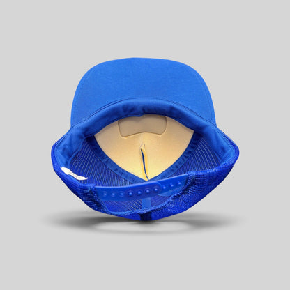 Raree Finds vintage 1980s royal blue trucker hat showing the interior mesh lining and adjustable plastic snapback