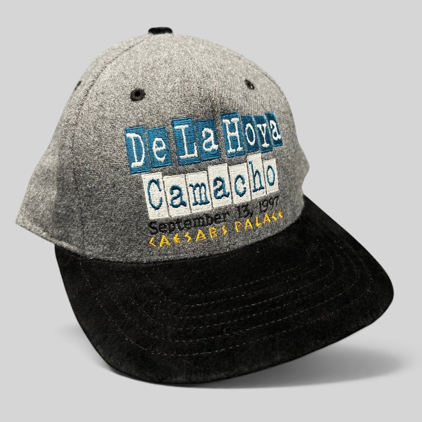 Raree Finds vintage 1997 De La Hoya vs Camacho boxing snapback hat with grey wool crown and black brim.