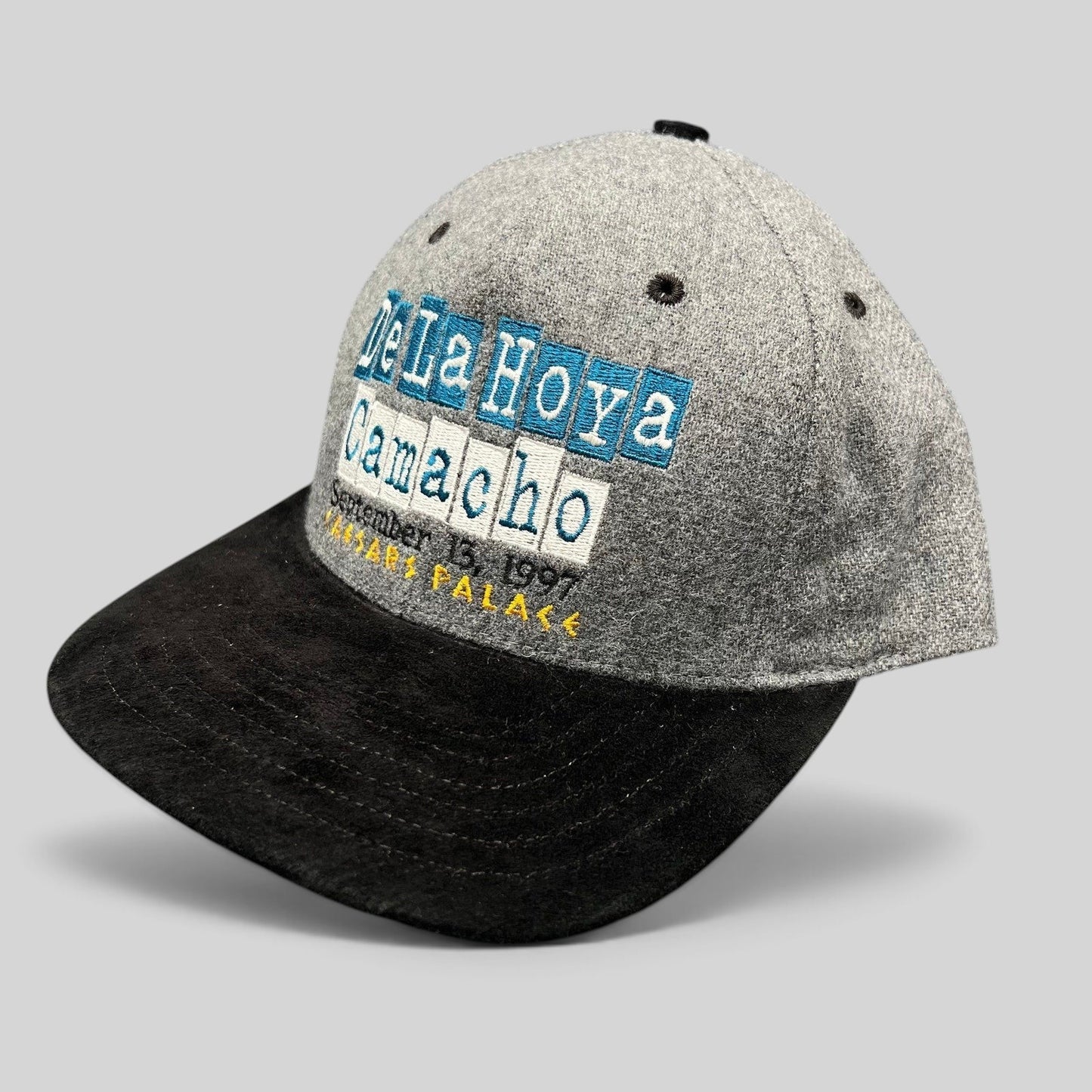 Raree Finds vintage 1997 De La Hoya vs Camacho boxing snapback hat with grey wool crown and black brim.